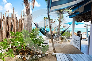 Hammock in the courtyard of the house with ocean views. Life in the tropics