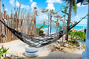 Hammock in the courtyard of the house with ocean views. Life in the tropics