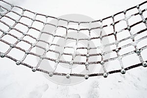 A hammock covered with snow