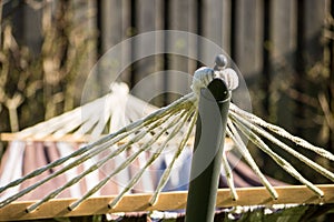 Hammock hanging in a garden in the afternoon