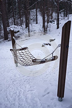 Hammock made of ropes in winter at the Aulanko Nature Activity Center. Hameenlinna, Finland