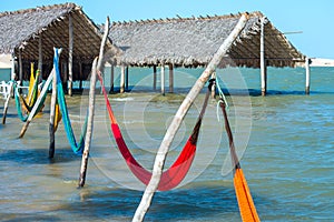 Hammocks under the shade of a palapa sun roof