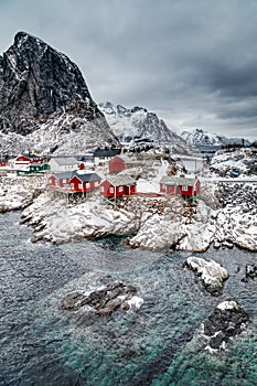 Lofoten Islands, Reine, Norway. Hamnoy fishing village with red fishing huts rorbu in winter.