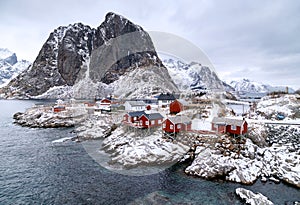 Lofoten Islands, Reine, Norway. Hamnoy fishing village with red fishing huts rorbu in winter.