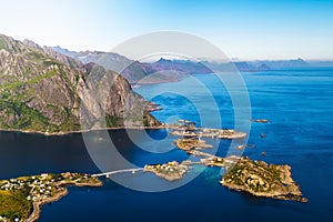 Hamnoy fishing village surrounded by high mountains and sea on Lofoten islands