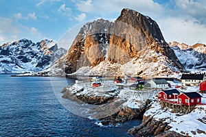 Hamnoy , Lofoten, Norway. Fisherman`s Village with snow and red houses