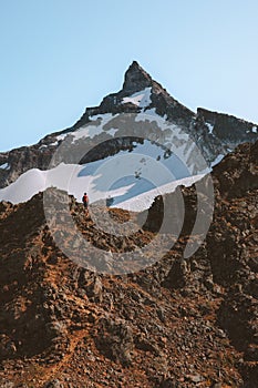 Hamperokken mountain peak in Norway man climbing solo travel adventure extreme active lifestyle