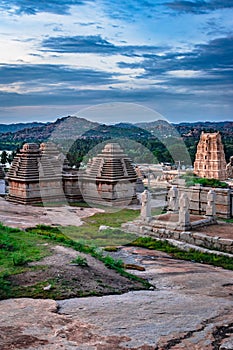 Hampi ruins ancient stone art with dramatic sky flat angle shot