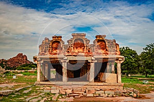 Hampi ruins antique stone art from unique angle with amazing sky