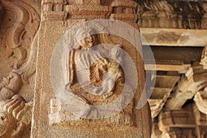 Hampi Vittala Temple Carving of the demoness putana - rakshasi feeding babykrishna