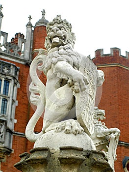 Hampton Court Palace Lion Statue at the gateway, London UK 