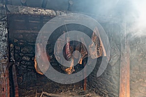 Hams Hanging in Vintage Smokehouse