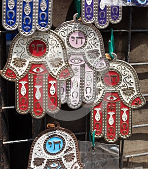 Hamsa with Chai symbol - Living sale at Carmel Market, popular marketplace in Tel-Aviv