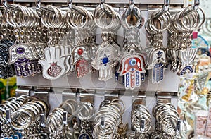 Hamsa keychains with Chai symbol - Living sale at Carmel Market, popular marketplace in Tel-Aviv