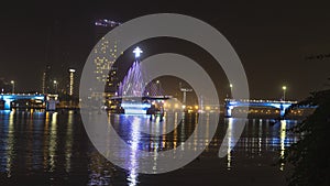 Han river bridge in Danang is opening in the evening ligtining