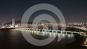 Han River at night Seoul glow bridge over water panoramic top view. Han River at night tradition and modernity