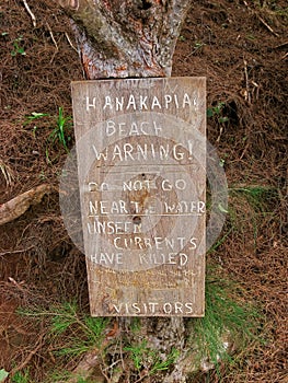 Hanakapiai Beach Wooden Sign Warning of Number of Drowning Deaths at Beach and Stay Away from Water