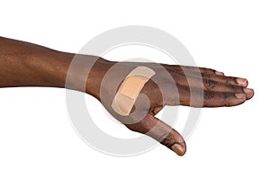 Hand with adhesive bandage isolated on white