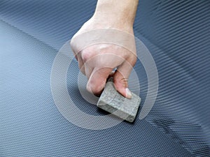 Hand with adhesive carbon foil