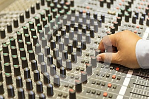 The hand adjust mixer table or fader board
