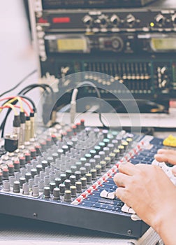 Hand Adjusting Audio Mixer