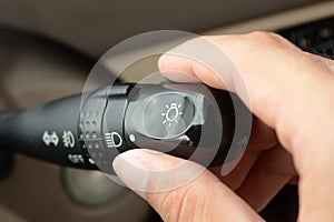 Hand adjusting car headlight control switch