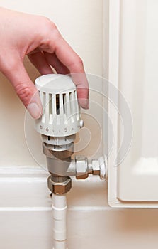 Hand Adjusting Thermostat On Radiator Valve