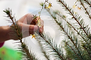 Hand adorn Christmas tree