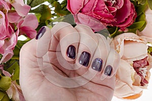Hand of an adult woman with painted nails, manicure, nail polish
