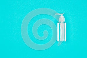 Hand alcohol sanitizer gel on blue background.