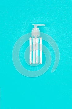 Hand alcohol sanitizer gel on blue background