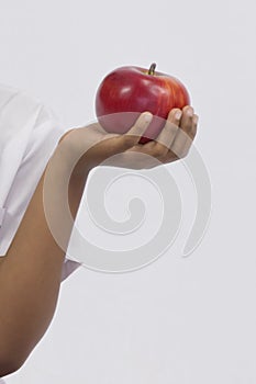 hand with apple on white background