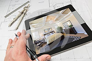 Hand of Architect on Computer Tablet Showing Bedroom Over House