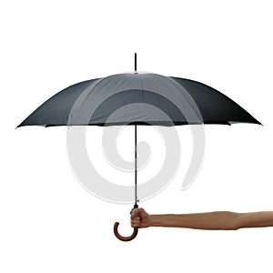 Hand and arm holding black umbrella