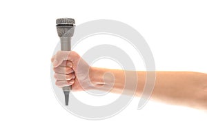 Hand and arm holding microphone isolated on white