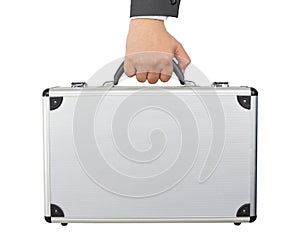 Hand and arm holding silver luggage or brief case isolated on white background.