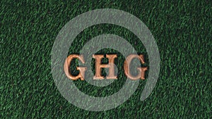 Hand arrange wooden alphabet text in GHG on biophilic background. Gyre photo