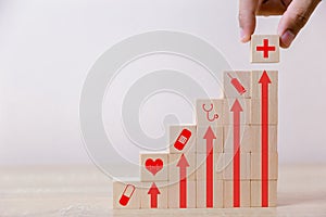 Hand arranging wood block stacking with icon healthcare medical, Insurance for your health concept