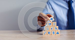 Hand arranging wood block stacking with icon healthcare medical, Insurance for your health medical, Insurance for your health