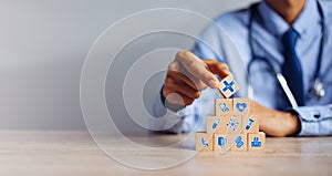 Hand arranging wood block stacking with icon healthcare medical, Insurance for your health medical, Insurance for your health