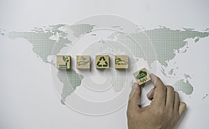 Hand array CO2 reducing ,Recycle ,Green factory icon on world map for decrease CO2 , carbon footprint and carbon credit to limit