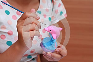 Hand art kid paint watercolor doll plaster for education.