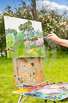 Hand of an artist in the open air