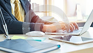 Hand asian  businessman using laptop in workplace