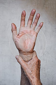 Hand of Asian elder man. Concept of joint pain, rheumatoid arthritis or hand problems