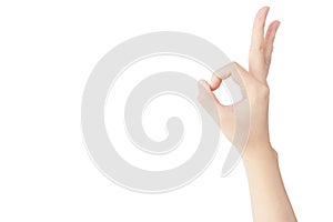 Hand of Asian woman is show OK gesture isolated on white background