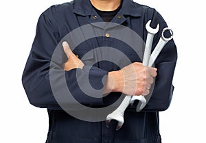 Hand of auto mechanic with wrench.