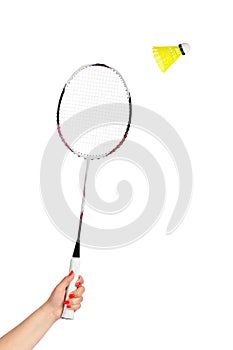 Hand with badminton racket and shuttlecock