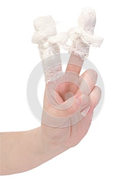 Hand with the bandaged, wounded fingers photo