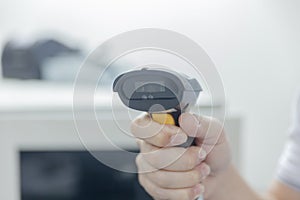 Hand with bar code scanner